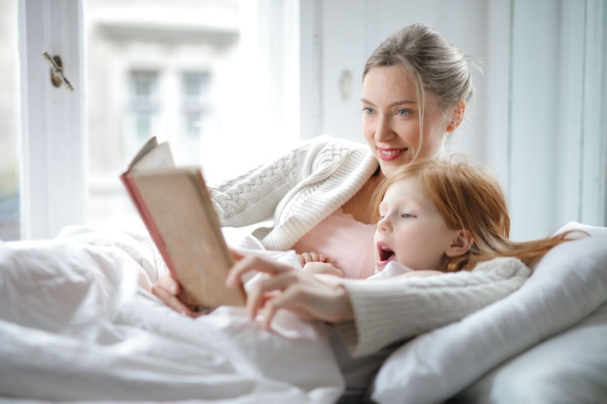 Mother reading with child during story time